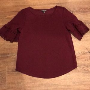 burgundy top with flared sleeves